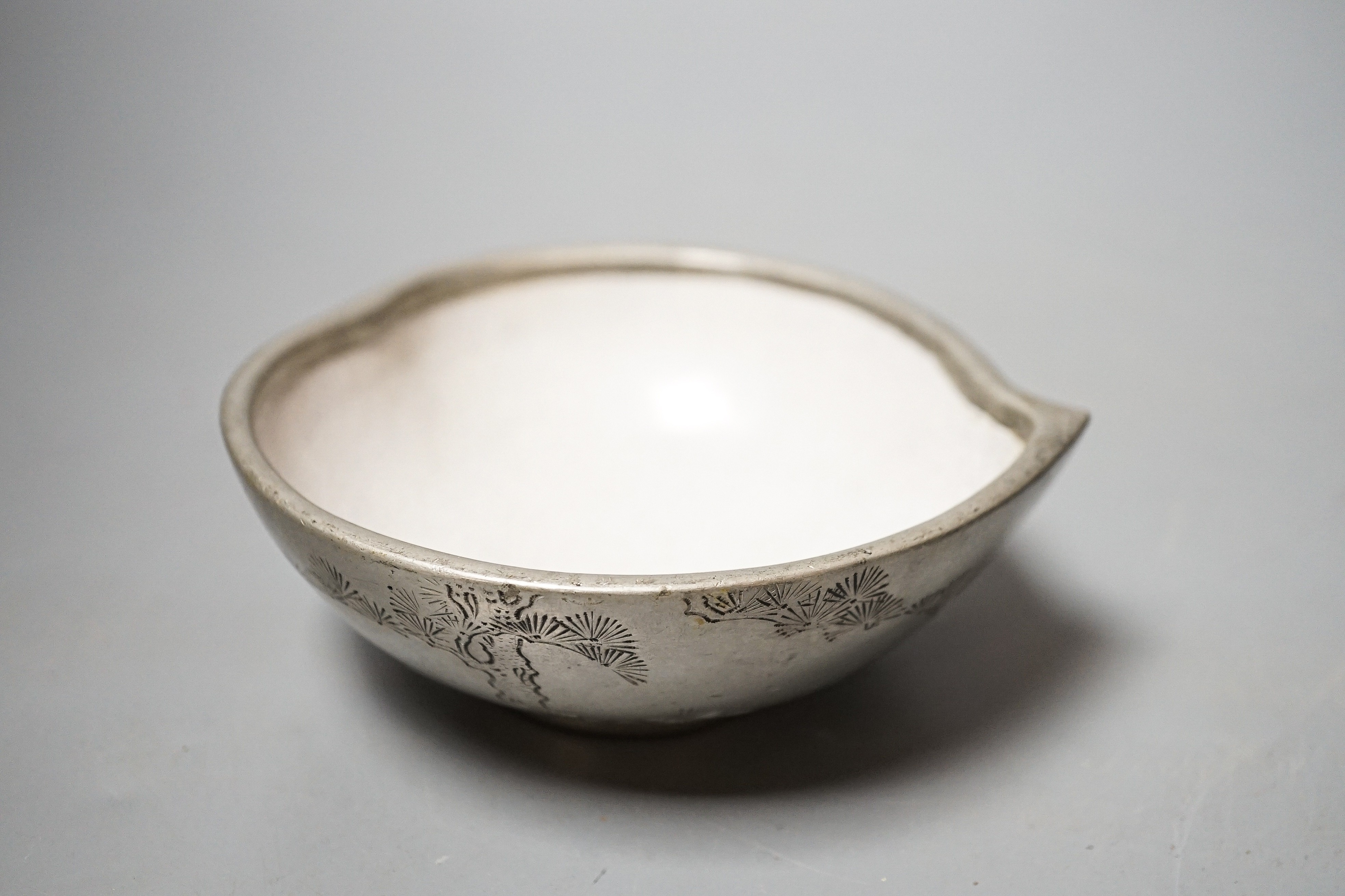A Chinese Yixing pottery and pewter mounted peach shaped cup, late 19th century, length 13cm